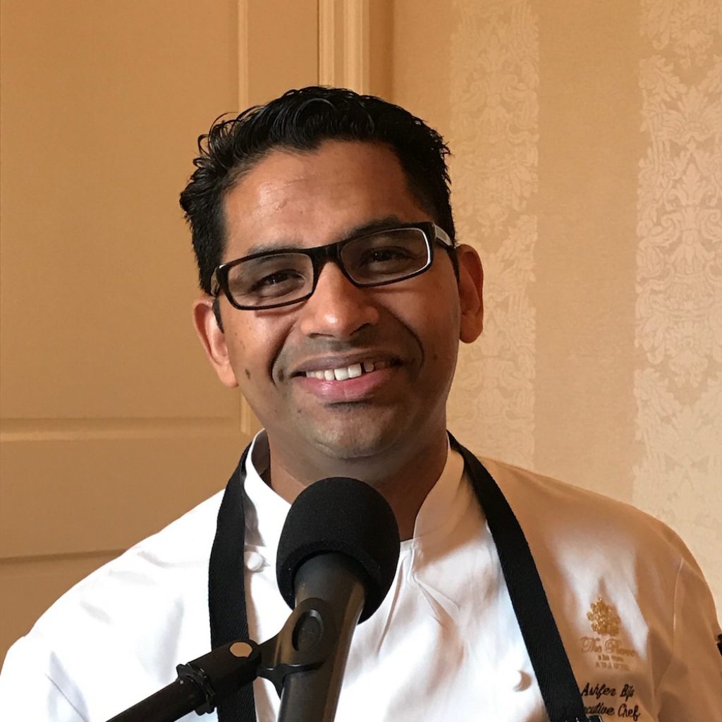 In today’s conversation, Andy talks with Ashfer Biju, the executive chef and food and beverage director at the iconic The Pierre, A Taj Hotel in New York City, responsible for all things culinary. To Ashfer, however, he’s more than his official job title; he’s a self-proclaimed “crafter of perishable art.”

After growing up in a small fishing town in India, Ashfer discovered his passion for food as a child and was driven to share his love with others ever since. With his entire family working in the restaurant industry in some fashion, Ashfer quickly dove into the hospitality industry and helped launch a vegetarian restaurant in India when he was only 18. He studied hospitality and pursued a degree at the Culinary Institute of America in Napa Valley, California. Soon after, Ashfer traveled to open restaurants around the world, from Berkeley to Mauritius and the Maldives. By 2009, when he had already opened numerous hotels and restaurants, the time for Ashfer to move to New York City had come.